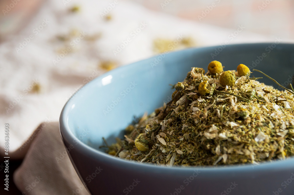 Round blue bowl with dried herb Round blue bowl with dried herb