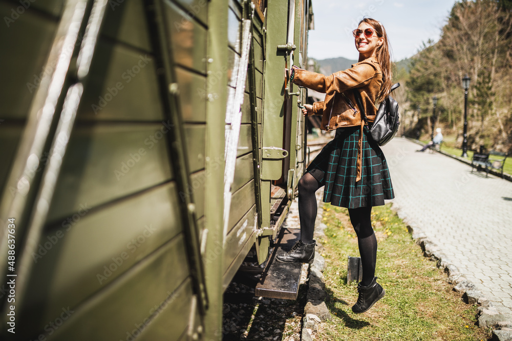 Woman Entering The Wagon Of Retro Train And Traveling To Adventure Woman Entering The Wagon Of Retro Train And Traveling To Adventure