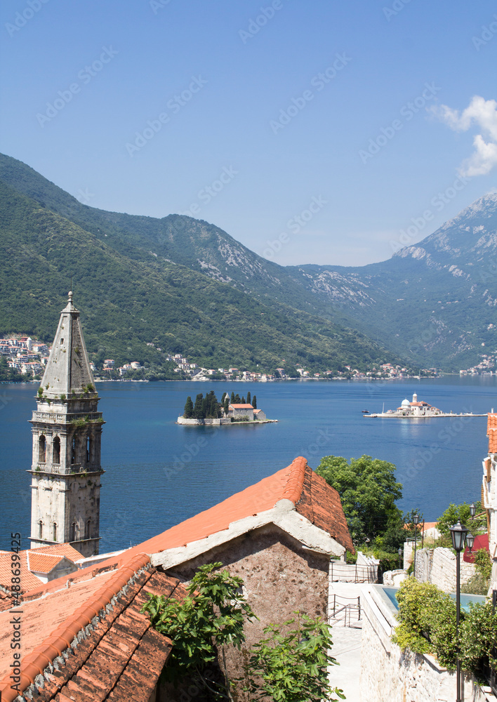 Panoramic view of the city, islands and bay on the sunny day. Perast. Montenegro. Location vertical.