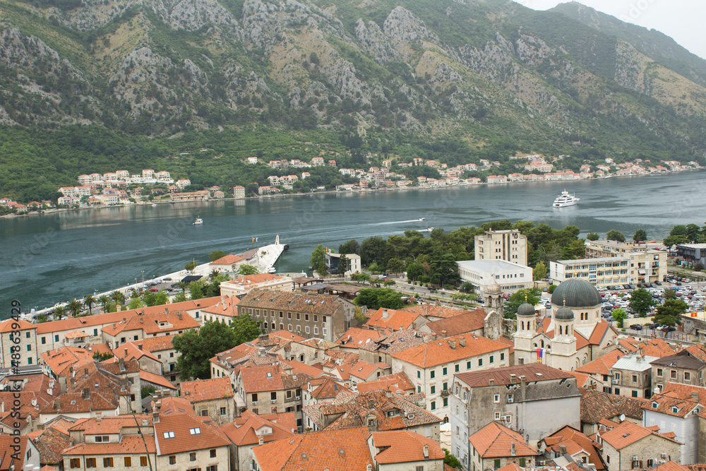 View of old city houses and embankment on a summer day. Kotor. Montenegro.