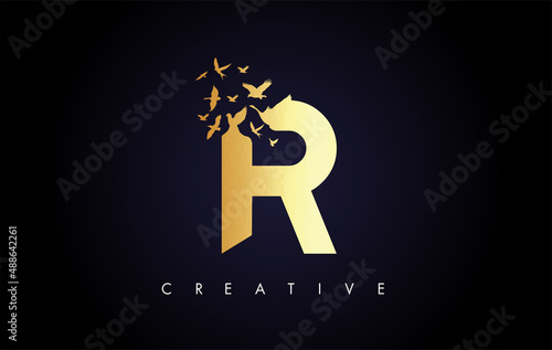 Golden R Logo Letter with Flock of Birds Flying and Disintegrating from the Letter.