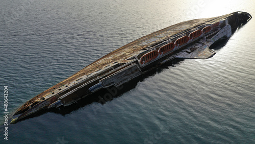 Fotografi Aerial drone top down photo passenger rusty ship wreck half sunk near shore
