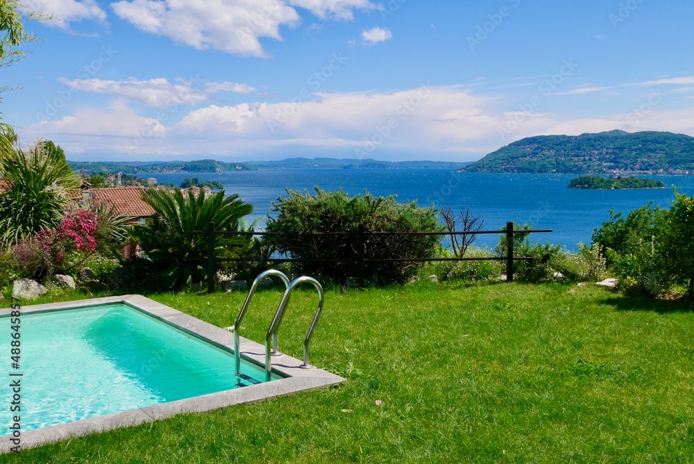 Pool on a hill above Verbania overlooking Lake Maggiore and the Barromean islands. Piedmont, Italy.