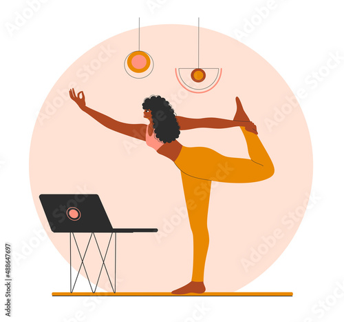 African American woman doing yoga at home. 