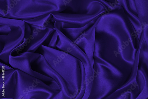 Purple silk or satin luxury fabric texture can use as abstract background.