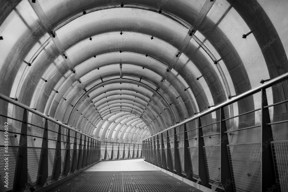 Tunnel-like bridge as a passage with semicircular metal struts.