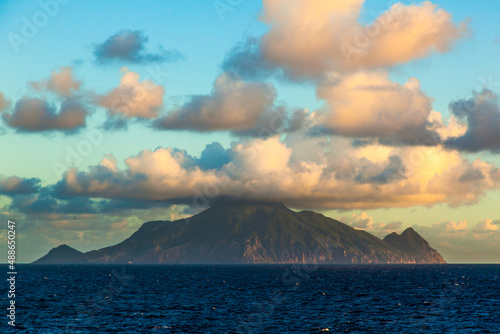 Mountain in the sea and clouds from above. Volcano in the sea off the coast of Italy.