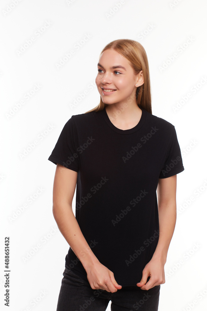 beautiful blond female posing with a blank black t-shirt. Ready for your design or artwork. beautiful blond female posing with a blank black t-shirt. Ready for your design or artwork.