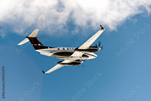 A private jet flying in the blue sky