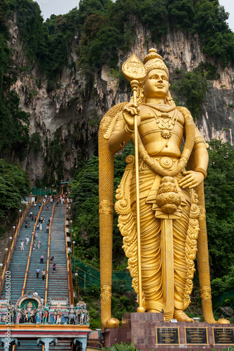 KUALA LUMPUR, MALAYSIA - DEC 2019: Murugan Statue (Tugu Dewa Murugga) in Batu Caves, Selangor, Kuala Lumpur. Tallest statue of a Hindu deity in Malaysia made with 300 liters of Gold Paint.