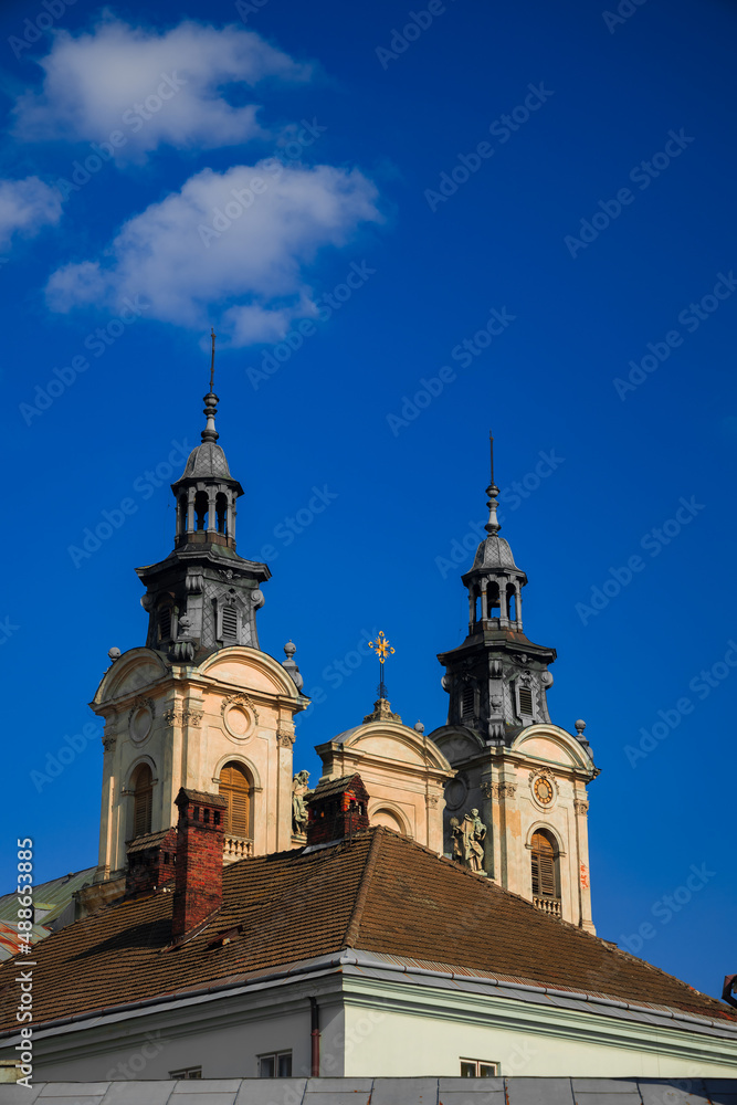 cathedral church tower architecture religion building roof top view, vertical photography on blue sky background