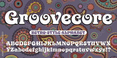 Groovecore is a stylized retro 1970s alphabet with curlicues and coiled shapes. This vintage font goes well with hippie and psychedelic graphic styles. Also features a paisley background pattern.