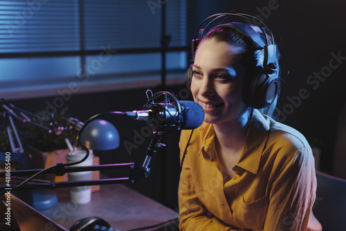 Young woman working at the radio station