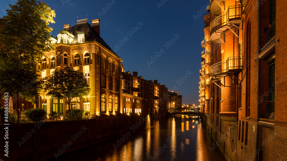 Speicherstadt Hamburg buildings illuminated in the blue hour.