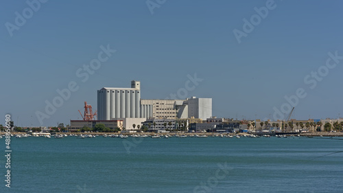 Harbour of Cadiz with silo`s and industrial buildings and cranes photo