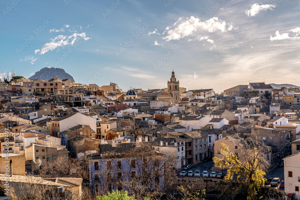 Old town of Relleu with its historic church, old houses and Puig Campana mountain in the background. Located in the province of Alicante, Spain