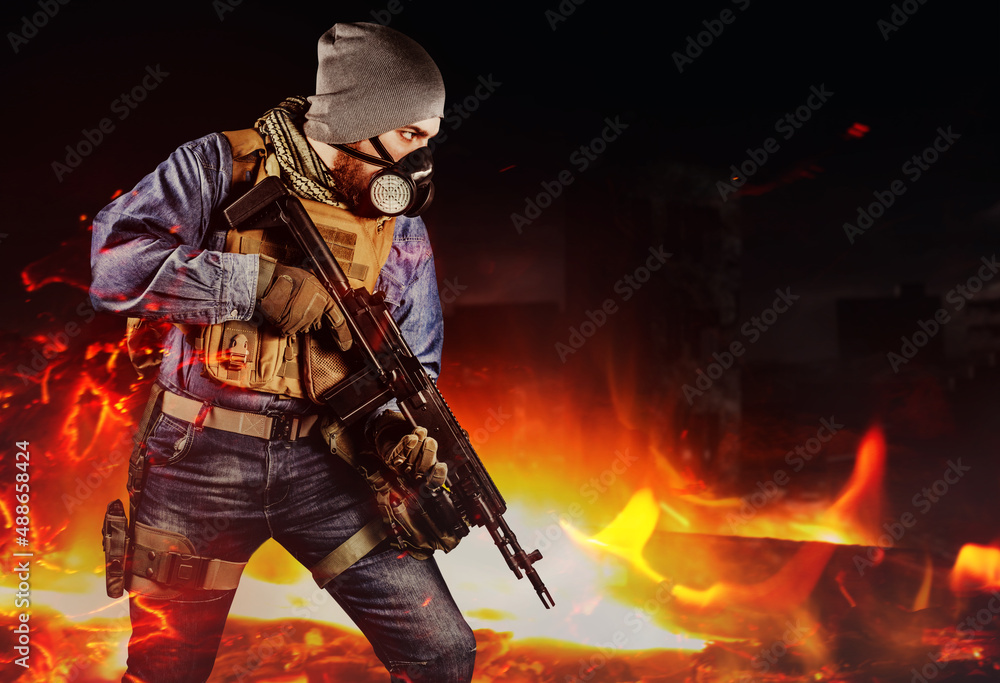 Photo of urban soldier in tactical military outfit and gas mask standing with rifle and gas mask on dark destroyed and burning city background. Photo of urban soldier in tactical military outfit and gas mask standing with rifle and gas mask on dark destroyed and burning city background.