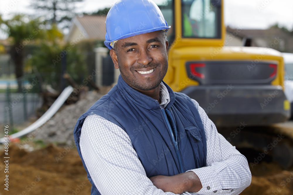 male engineer standing confidently with a crossed arms