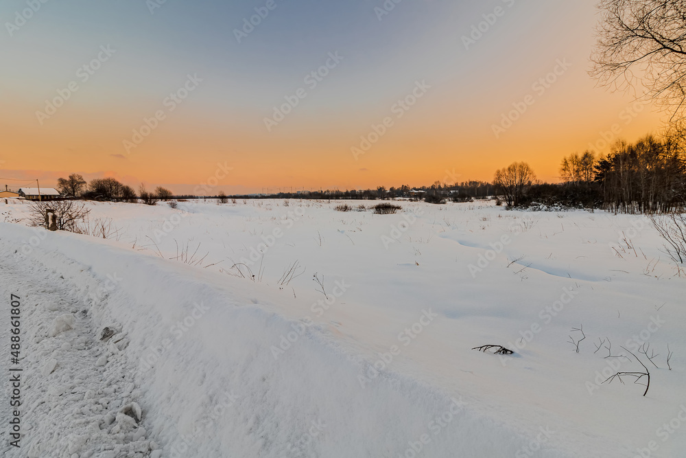 Sunset over a snowy field