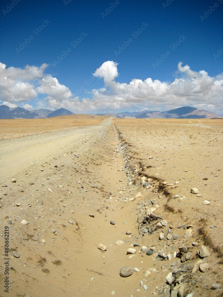 sandy road in the mountains of Tibet sandy road in the mountains of Tibet