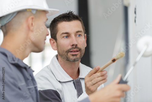 commercial painting trainer assisting the student
