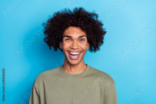 Photo of youth cheerful guy good mood laughing humorous comedy april isolated over blue color background