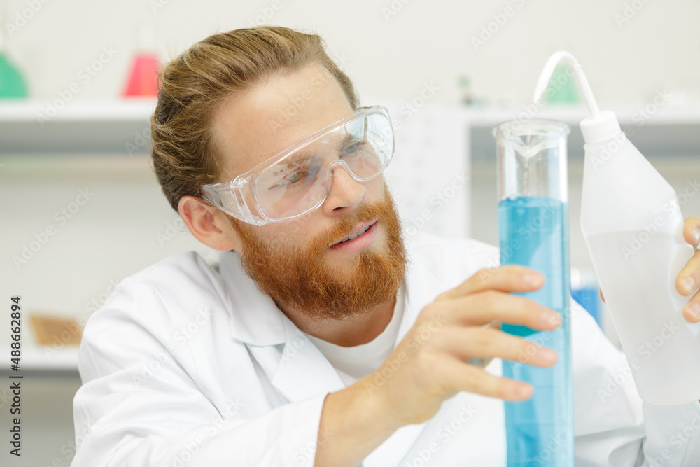 scientists working with large vat in the lab scientists working with large vat in the lab