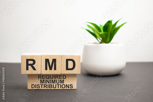 rmd, required, minimum, distribution written on wooden blocks, customer relationship management, success in business concepts, photo