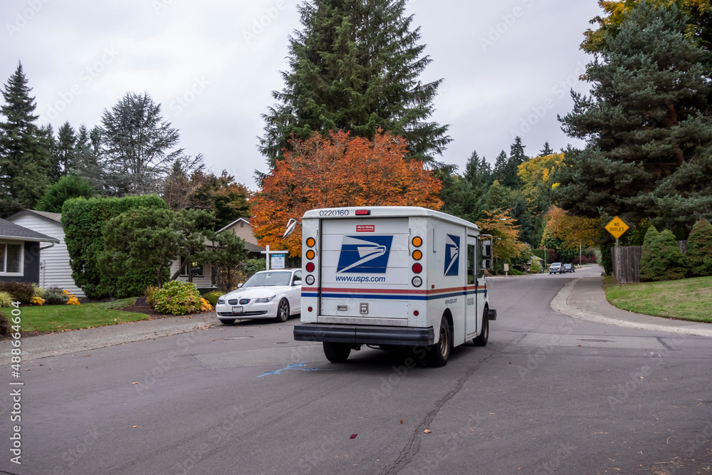 Kirkland, WA USA circa October 2021 Street view of a USPS mail truck