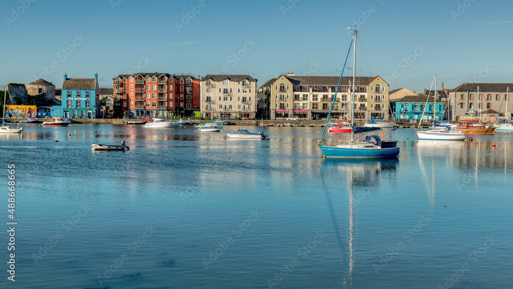 Dungarvan Bay in Waterford Ireland on high tide with boats reflection