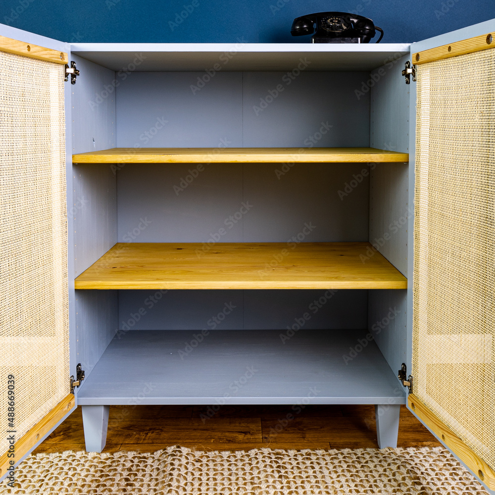 Blue painted furniture with rattan doors