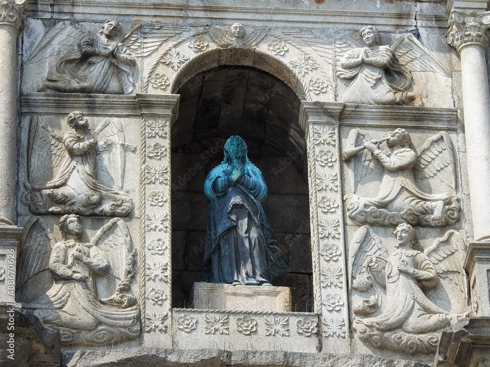 Macau, Island of Macau, China - September 13 2019: details of the  St. Paul`s Cathedral ruins, with a statue of a saint
