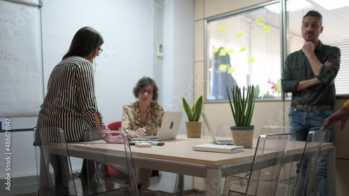 Diverse group of people preparing a project in an office. photo