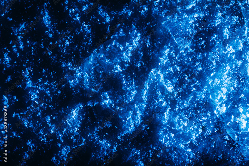 Photo of dark blue toned frozen snow surface texture. Stock Photo ...