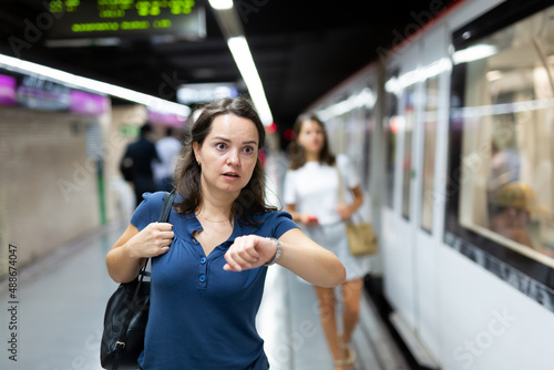 Hurrying woman is late for subway train. High quality photo photo