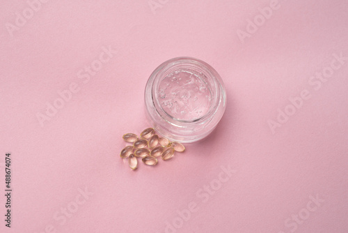 Gel with hyaluronic acid in a glass jar and capsules