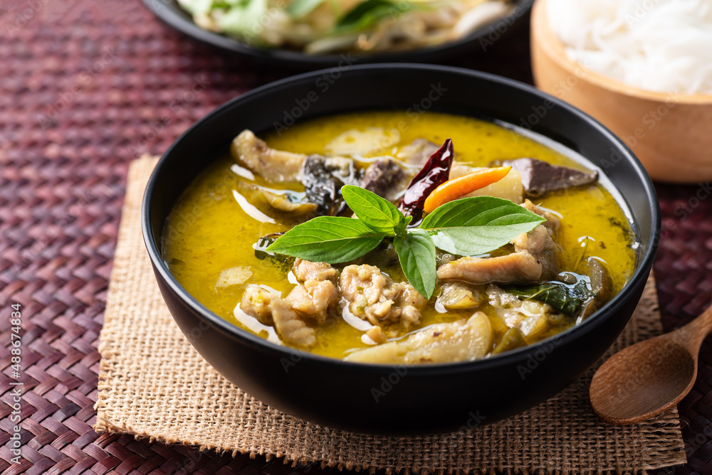 Thai food, Green curry chicken eating with rice noodles and fresh vegetables Thai food, Green curry chicken eating with rice noodles and fresh vegetables