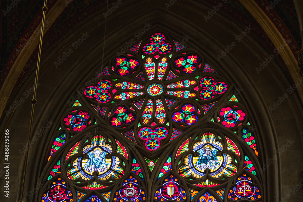 Church vitrage glass, stained glass mandalas. Interior Votive Church, Votivkirche, neo-Gothic style. 