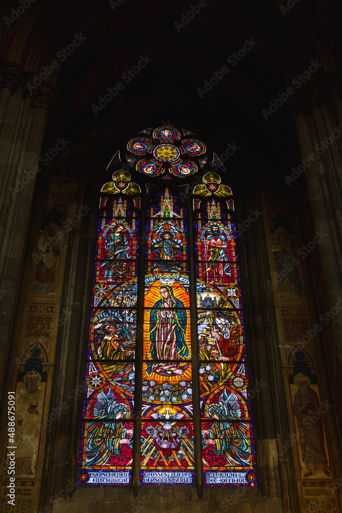 Church vitrage glass, stained glass mandalas. Interior Votive Church, Votivkirche, neo-Gothic style. 
