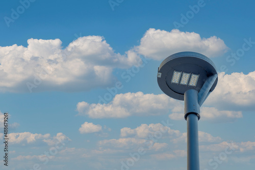 led street light on cloudy sunny weather background