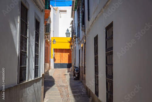Cordoba streets on a sunny day in historic city center near Mezquita Cathedral.