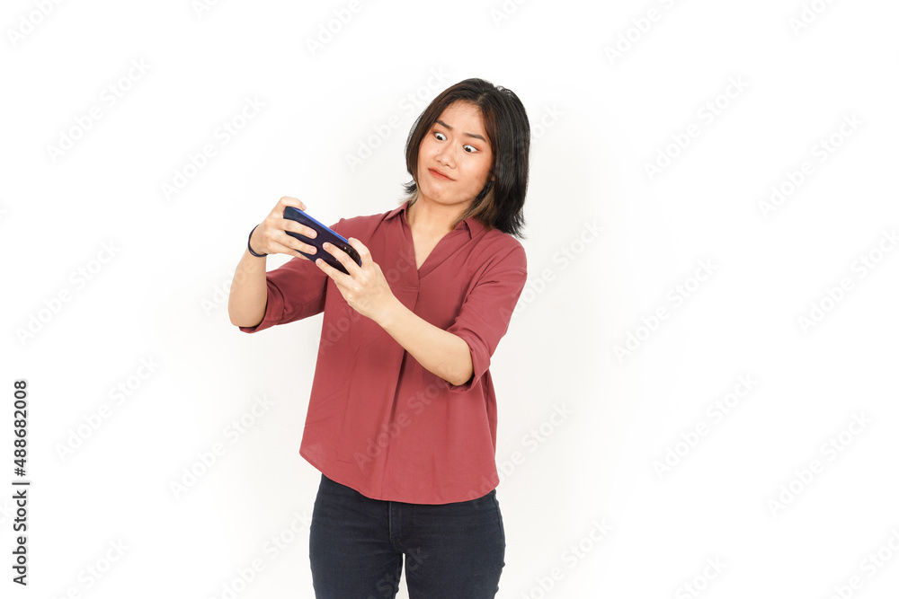 Playing Mobile Game on Smartphone Of Beautiful Asian Woman Isolated On White Background Playing Mobile Game on Smartphone Of Beautiful Asian Woman Isolated On White Background