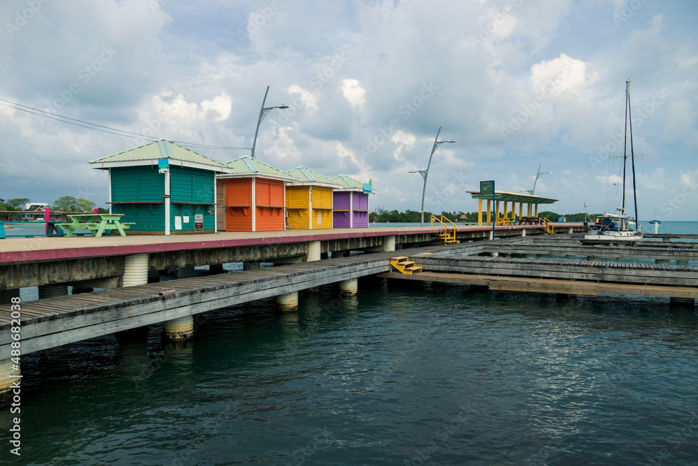 Colorful houses at the pier of the harbor of Placencia, Belize