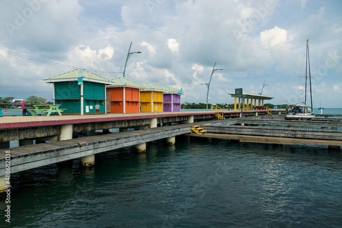 Colorful houses at the pier of the harbor of Placencia, Belize