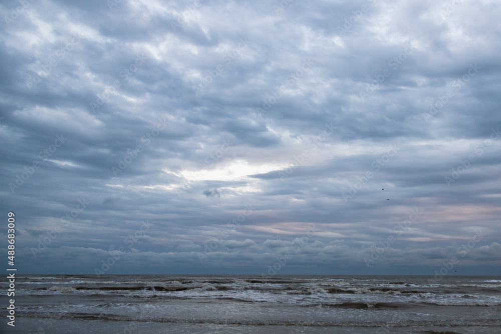 Ocean, beach and storm sky