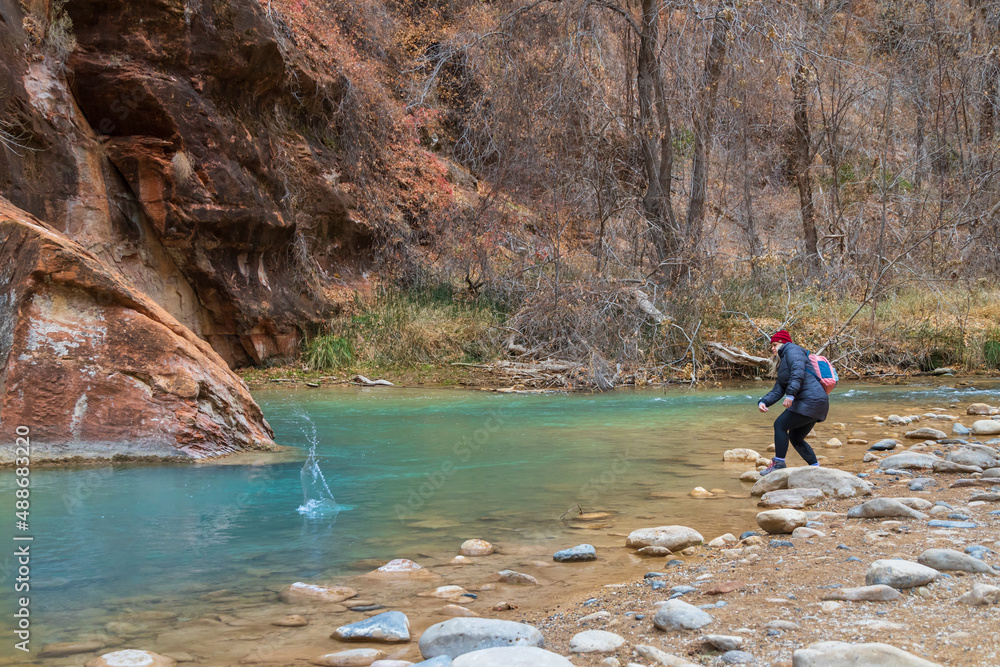 Girl skipping rocks in Zion National Park, Utah Girl skipping rocks in Zion National Park, Utah