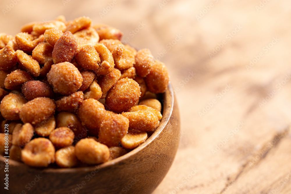 Honey Roasted Peanuts on a Wooden Table Honey Roasted Peanuts on a Wooden Table