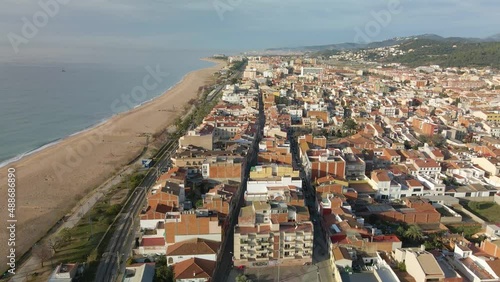 Aerial drone view of Malgrat de Mar city in Spain Maresme tourist town beach views photo