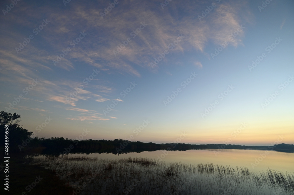 Haze from prescribed burn at sunrise on Nine Mile Pond in Everglades National Park, Florida.