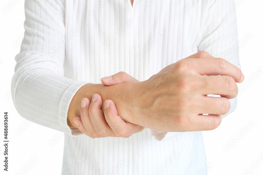 The man touches the wrist and thumb. He squeezes the knuckle of the thumb and wrist. He suffered a tendon injury, arthritis in his wrist, and de Quervain's disease.